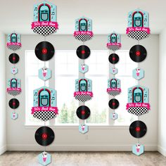 the wall is decorated with record players and numbers for birthdays or baby's 1st birthday