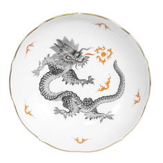 Symbolizing preternatural wisdom, the spirit of change, sun, light and the male power of the yang, the Chinese Ming dragon is one of the oldest and most popular designs by Meissen.  Although created in 1740 based on Asian templates, its interpretation on clear, architectural shapes and a gold rim gives it a more classic look.  Note the dragon with four toes: these were originally reserved for items used by royal princes in ancient China.  Founded in 1710 by King Augustus the Strong, Meissen is t Cleaning Dishwasher, Pink Dinner Plates, Dragon Black, Tea Saucer, Leather Photo Albums, Baccarat Crystal, Gold Monogram, Ancient China, Dinnerware Sets