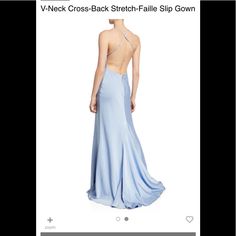 the back of a blue dress is shown in an image that appears to be on sale