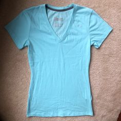 Never Worn Cotton Material Fits Like S Light Blue Fitted V-neck T-shirt, Nike Casual V-neck Top, Fitted Blue Nike Tops, Light Blue Cotton V-neck T-shirt, Light Blue Nike Cotton Tops, Fitted Nike Cotton T-shirt, Nike Fitted Cotton T-shirt, Nike Light Blue Cotton Tops, Blue Nike