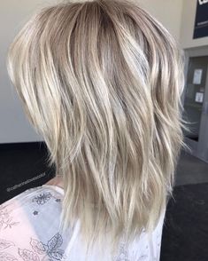 Medium Length Ash Blonde Shag Hairstyle Gallery