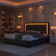 a bedroom with a large bed and two lamps on either side of the headboard