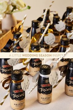 bottles of wedding seasoning are sitting on a table