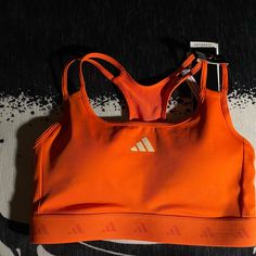 Size Xs In Women, Brand New :) Sporty Seamless Orange Top, Sporty Orange Seamless Top, Adidas Summer Sports Activewear, Spring Orange Activewear For Sports, Casual Orange Sports Bra For Gym, Adidas Casual Sports Bra, Adidas Sports Bra With Medium Support, Adidas Fitted Sports Bra Athleisure, Adidas Fitted Sports Bra For Training