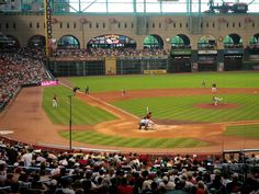 a baseball game in progress with the batter up to plate