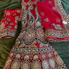 Beautiful Red Lengha , Veryyyy Heavy Work , Perfect For A Bride Or A Fancy Event .. Brand New Never Worn , Paid $1200 But Didn’t Fit Me. This Outfit Weighs 10lbs , It Is Very Beautiful And Expensive Festive Dresses With Traditional Drape And Intricate Design, Red Embellished Dupatta, Formal Embroidered Red Sharara, Formal Red Embroidered Sharara, Red Embellished Fitted Dupatta, Fitted Red Embellished Dupatta, Red Choli With Traditional Drape For Formal Occasions, Elegant Red Saree Set With Pallu, Elegant Red Saree With Pallu