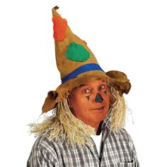 a man wearing a scarecrow hat with long hair and painted face on his head