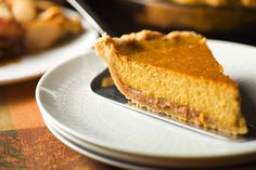 a slice of pumpkin pie on a plate