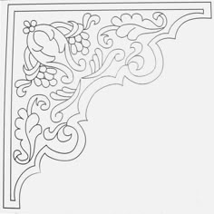 an ornate design with flowers and leaves in the center, on a white paper background