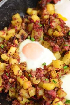 fried eggs and hash browns in a skillet