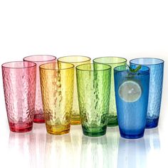 a row of colorful glasses sitting next to each other