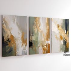 three abstract paintings hanging on the wall next to each other