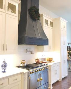 a kitchen with an oven, stove and counter tops in it's center island