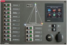 the control panel for a boat is shown with buttons and switches on each side of it