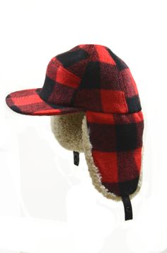 Shell: Grey-50% Wool, 50% Viscose; Red-85% Wool, 15% Nylon Trim: 100% Shearling Lining: 100% Polyester Made in Canada Washing Instructions: Fur clean only Black Trapper Hat, Plaid Outerwear, Lumberjack Plaid, Luxury Hats, Aviator Hat, Snow Rain, Trapper Hat, Outdoor Hats, Trapper Hats