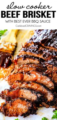 slow cooker beef brisket with bbq sauce on a white plate and garnished with parsley