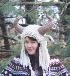 a woman wearing a knitted hat with horns