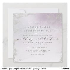 an elegant wedding card with silver foil on it