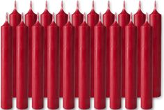 many red candles are lined up against a white background with one candle in the middle