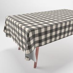 a black and white checkered tablecloth with wooden legs