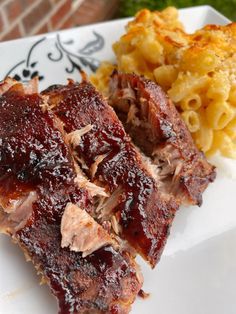 ribs, macaroni and cheese on a plate