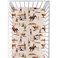 a child's crib sheet with horses and people on it in the background