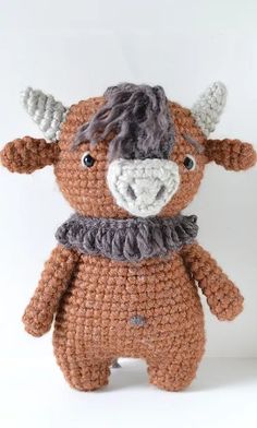 a crocheted stuffed animal with horns on it's head