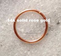 14K SOLID GOLD single hoop earring►ROSE or YELLOW SOLID GOLD 14k NOT plated or gold filled!!!❖ Please choose your needed gauge size (g) / inner diameter (mm) ►Inner DIAMETER of the hoop : Please choose your inner dimeter: 7/8/9 mmEveryones facial features are different ☺ 7 mm (snug/tragus piercing fit)8 mm (common for all types- nose, upper earlobe fit)9/10 mm (lower earlobe)► Please choose gauge for your hoop:★Gauge: the thickness of the wirethe smaller the gauge the thicker the earring shaft i 14k Rose Gold Nose Rings, Rose Gold Hoop Nose Rings As Gift, 14k Rose Gold Nose Rings As Gift, Tragus Piercings, Nose Ring Stud, Helix, Nose Piercing, Tragus, Rose Gold Ring