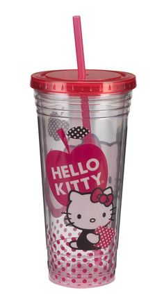 a hello kitty cup with a straw in the shape of an apple and polka dots