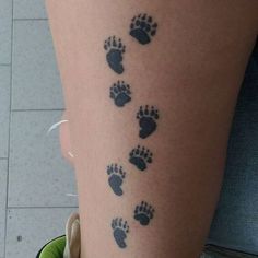 an image of a person's leg with foot prints on the side of it