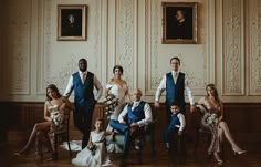 a group of people in formal wear posing for a photo