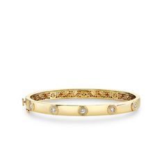 14k yellow gold multi bangle features five fluted diamond on one side only. 14k gold bracelet measures 6 1/4" in diameter and approximately 1/4"H X 2 1/2"W. Timeless Formal Bangle With Single Diamond, 14k Gold Wedding Bangle With Single Diamond, Classic Single Diamond Bangle For Wedding, Classic Stackable Gold Bracelet With Diamonds, Classic Gold Diamond Stackable Bracelet, Classic Gold Bracelet With Diamonds, Stackable, Diamond Jewelry With Fluted Bezel And Round Cut, Luxury 14k Gold Bangle With Single Diamond, Classic Gold Bracelet With Single Diamond For Formal Occasions