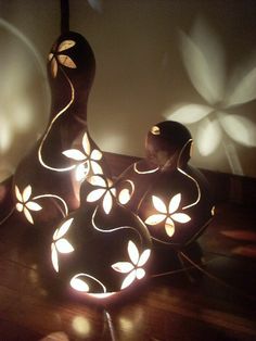 two decorative lights sitting on top of a wooden table