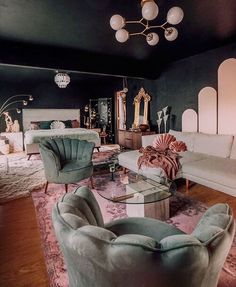 a living room filled with furniture and a chandelier