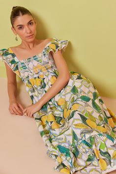 Multi color midi dress with all over abstract lemon prints. - Aza Fashions Green Fruit Print Dresses For Spring, Yellow Summer Dress With Fruit Print, Green Lemon Print Dress For Garden Party, Casual Lemon Print Midi Dress For Summer, Casual Lemon Print Midi Dress For Spring, Lemon Print Sundress For Garden Party, Casual Summer Midi Dress With Lemon Print, Midi Length Lemon Print Dress For Garden Party, Casual Spring Midi Dress With Lemon Print