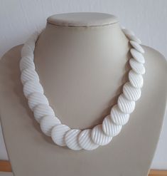 Chunky vintage retro white lucite plastic beaded necklace with big textured scale overlapping discs beads and with clasp. Length: 17.5 inches; beads: 25 x 22  mm diameter. Good vintage condition - may need some cleaning on some beads  -sold as is. To make this a smooth and pleasant transaction experience for everyone, all buyers need to read and understand the description, the terms of sale, the payment and the shipping indicated in this listing. Return not accepted - please ask before purchase. Beaded Choker Necklace, Plastic Beads, Beaded Choker, Choker Necklace, Retro Vintage, Vintage Items, Beaded Necklace, Jewelry Necklaces, Bathing Beauties