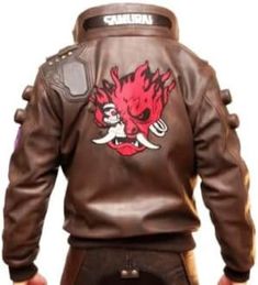 A brown samurai bomber jacket is a stylish and unique piece of clothing that combines the elements of a traditional Japanese warrior and a modern cyberpunk aesthetic. It is inspired by the video game Cyberpunk 2077, where the main character V wears a similar jacket with the logo of the fictional rock band Samurai on the back. Here are some possible descriptions for your brown samurai bomber jacket: * A sleek and edgy brown leather jacket with a stand-up collar and a Samurai patch on the back. This jacket is perfect for anyone who loves cyberpunk style and wants to channel their inner rebel. * A futuristic brown bomber jacket made from high-quality faux leather. It features a buttoned stand-up collar, an open front, and a large Samurai logo on the back. This jacket is ideal for fans of Cybe Gaming Cosplay, Cyberpunk Jacket, Brown Faux Leather Jacket, Custom Jacket, Halloween 2019, Cyberpunk 2077, Brown Leather Jacket, Jacket Design, Leather Jacket Men