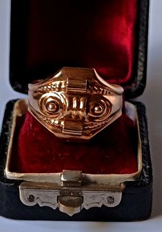 This is an antique ring from the Biedermeier period. The face of the ring is hollow worked as it was common for Biedermeier jewelry.  It's 8k gold. Very unusal! The ring look a little bit like a tank ring or an asian dragon mask to me. Inner diameter is 20mm Approx. size: US 10, UK U 1/2, German 63 It's resizeable! Weight: 4,10gr The pictures are enlarged and are a part of the description! This is unique Antique and Vintage jewelry which is 50-200 years old so it's normal that these pieces have Antique Engraved Ring With Decorative Band, Victorian Rings With Decorative Band For Formal Events, Victorian Rose Gold Hallmarked Ring, Antique Ceremonial 14k Gold Rings, Antique 14k Gold Ceremonial Rings, Antique 14k Gold Rings For Ceremonial Occasions, Antique 14k Gold Dome Ring, Antique Dome Ring Stamped 14k, Tank Ring