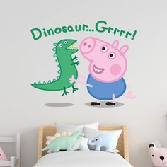 a child's bedroom with a wall decal featuring peppa pig and an alligator