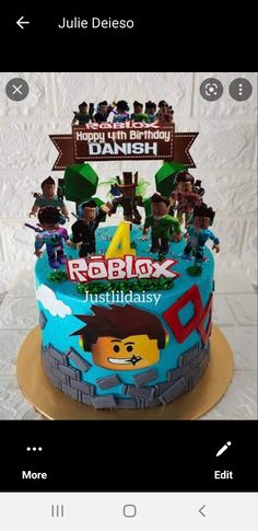 a cake that is decorated with legos on top of it and the name robblox