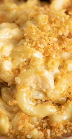 macaroni and cheese is in a bowl with bread crumbs on top