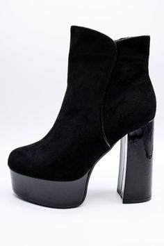 a pair of black high heeled boots