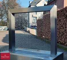 a water fountain in front of a house