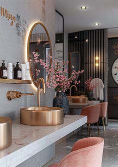 a bathroom with pink chairs and gold fixtures