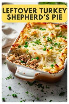 a casserole dish with meat and vegetables in it on a white surface, text overlay reads leftover turkey shepherd's pie