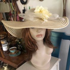 This Beautiful Vintage Wide Brim Sheer Soft Yellow Polypropylene Derby Hat Features A Netted Band Surrounding The Crown/Brim Finished In The Front With A Wide Netted Double Flat Bow Topped With Feathers And A Frilly Yellow Silk And Lace Rosette ~ Something Special. Inside Lined In Matching Grosgrain Ribbon. Inside Circumference 22”; Brim 6”; Crown Height 6”. In Excellent Preowned Vintage Condition. Smoke-Free Home. Crown Heights, Silk And Lace, Yellow Hat, Elegant Hats, Yellow Silk, Derby Hat, Bow Flats, Soft Yellow, Derby Hats