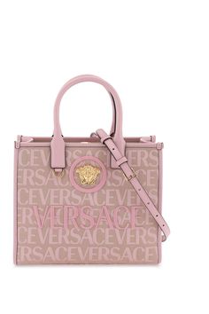 Versace tote bag made of jacquard canvas with Versace Allover pattern and decorated with La Medusa plaque at front and tone-on-tone lettering logo emrboidery. Strap and magnetic button closure, two interior zippered pockets, top handles, adjustable and removable shoulder strap. Gold-finished metalware. Size Info STANDARD Color Detail Mixed colours Made In Italy Material 60%PL 40%CO Season One fall Season Two winter Product bags Brand Versace Size And Fit Bag Length = 29,5 cm, Bag Height = 24 cm, Versace Tote Bag, Versace Pink, Allover Pattern, Pink Tote Bags, Lettering Logo, Small Tote Bag, Luxury Designer Handbags, Crossbody Tote Bag, Pink Tote