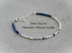 This Morse code bracelet see you in heaven, makes a great memorial bracelet for anyone.  It would also make a great pet sympathy bracelet. Sympathy jewelry is a great way to keep that special someone close to your heart. Details: ~Bracelet measures 7" with a 1" extension ~Made of blue glass seed beads ~Finished with a lobster clasp ~A silver round bead hangs from the extension All jewelry comes in a gift box with a bow already for gift giving so you don't have to worry about wrapping it. It will also come with the card that says what the bracelet says.  Thanks for looking! Bracelet Morse Code, Bracelet Morse, Wheeling Wv, Diy Jewelry Making Tutorials, Until We Meet Again, Memorial Bracelet, Morse Code Bracelet, Pet Sympathy, Clay Bracelet