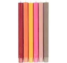 four different colored candles are lined up in a row on a white background, one is pink, the other is orange