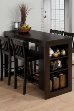 a dining table and chairs with baskets on it